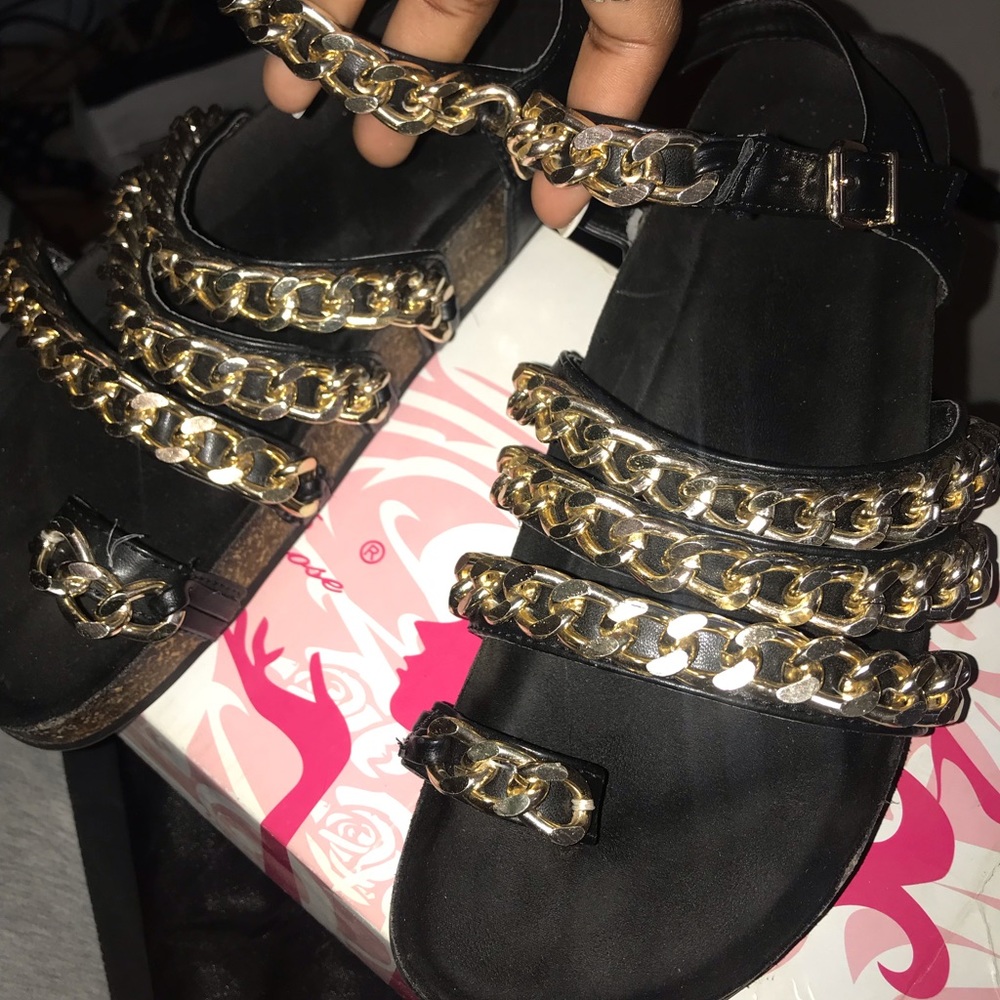 gold and black sandals